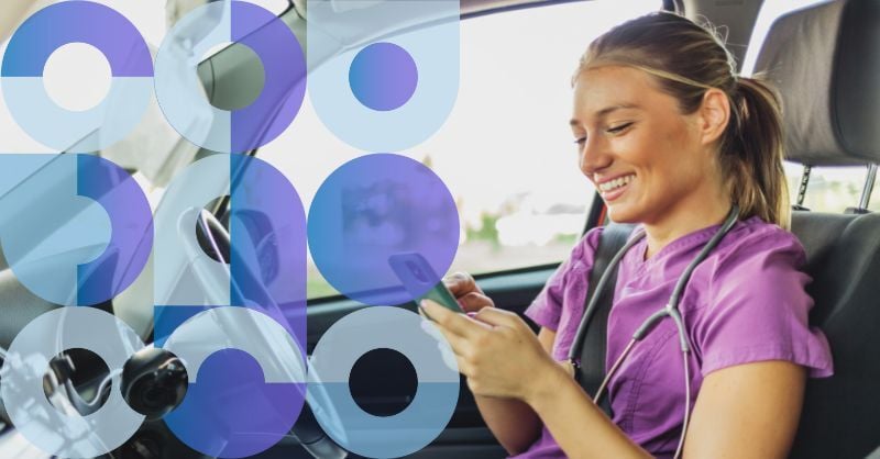 A happy care worker sitting in their car