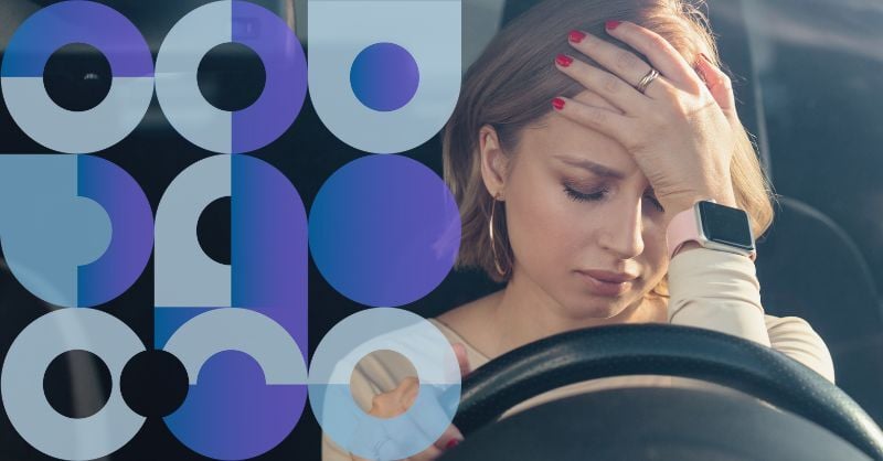 Importance of carer wellbeing - a burnt out care worker sitting in their car