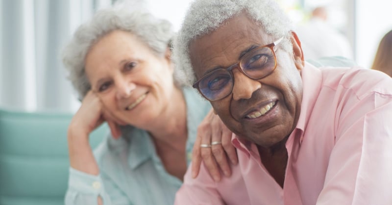 A smiling elderly couple